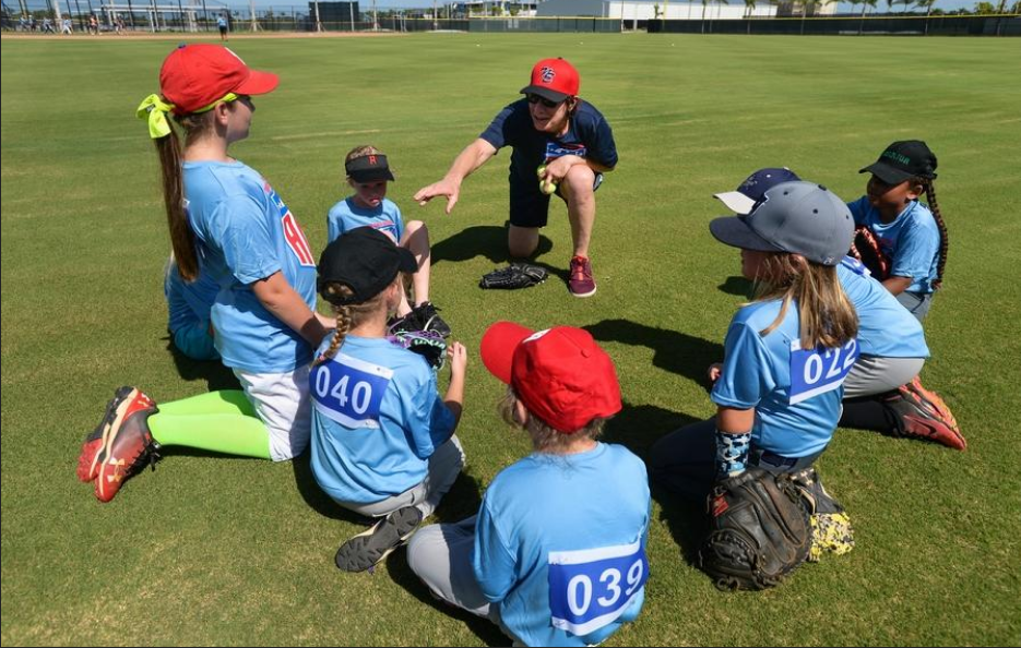 Coach Janet Miller of the New England Women’s Red Sox mentors kids participating in Friday’s camp at Cool Today Park in North Port. [HERALD-TRIBUNE STAFF PHOTO / DAN WAGNER] 