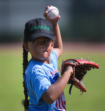 Michaela Beachy, 7, of North Port lines up her throw during camp at Cool Today Park. STAFF PHOTO/ DAN WAGNER