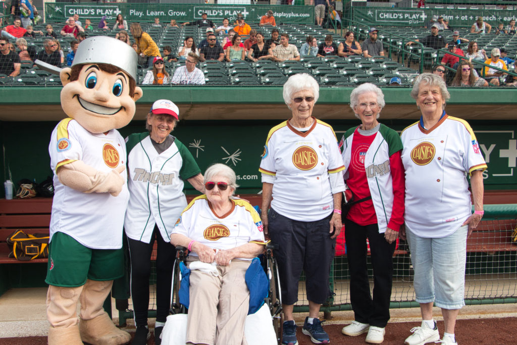 From Left: Tin Cap mascot, former AAGPBL players Jeneane Lesko, Lefty (in wheelchair), Katie Horstman, Mary Moore, and Dolly Ozburn. 