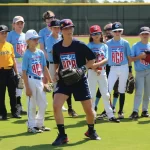 Marti Semitelli, a member of the USA Baseball women’s team that won a gold metal in the 2015 Pan Am games, coaches girls at an American Girls Baseball clinic.