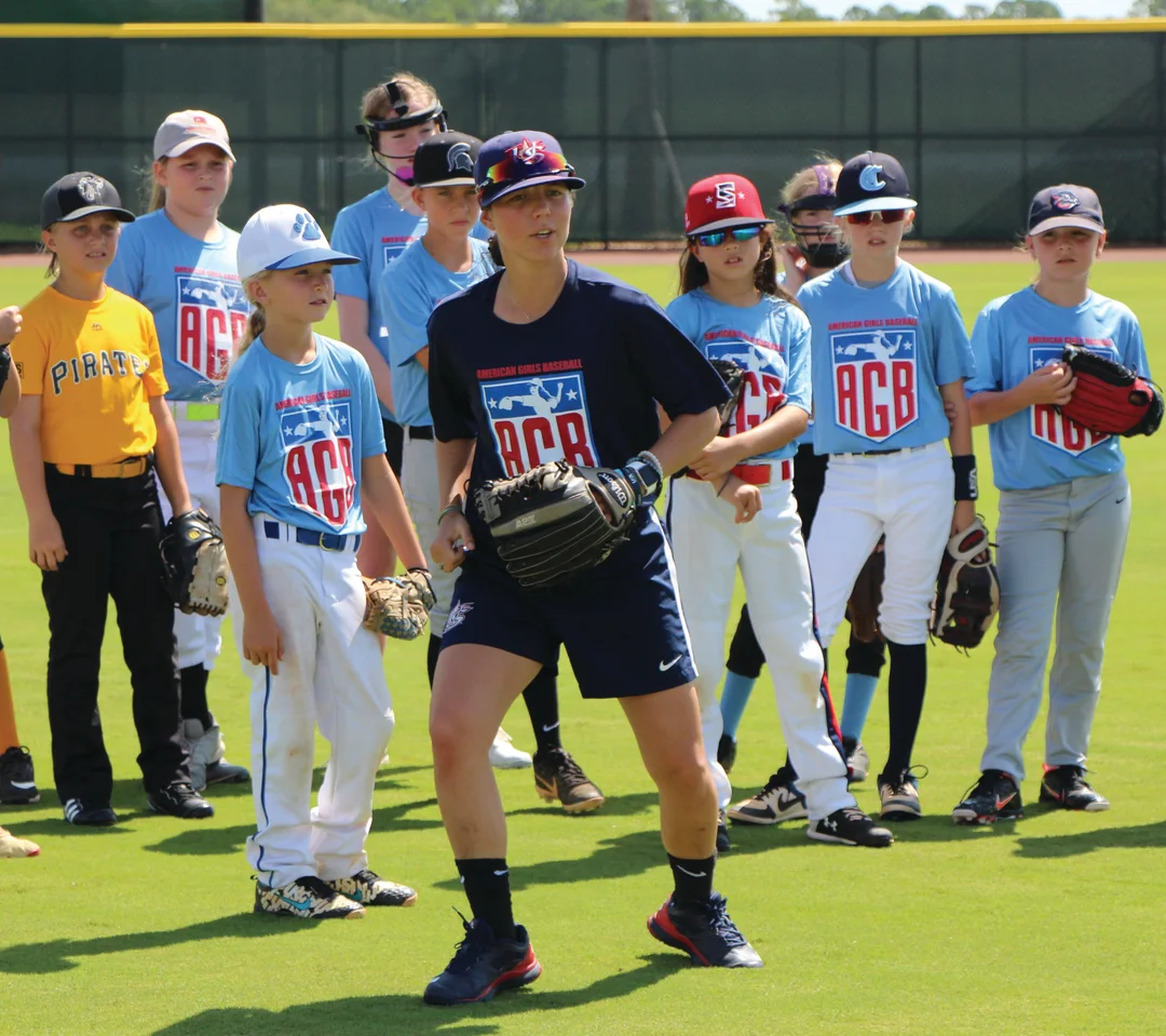Marti Semitelli, a member of the USA Baseball women’s team that won a gold metal in the 2015 Pan Am games, coaches girls at an American Girls Baseball clinic.